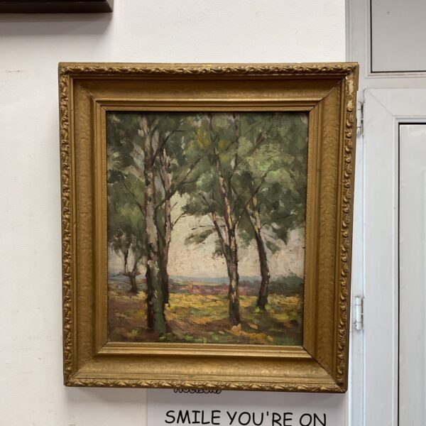 Framed woodland oil painting depicting a serene forest scene.