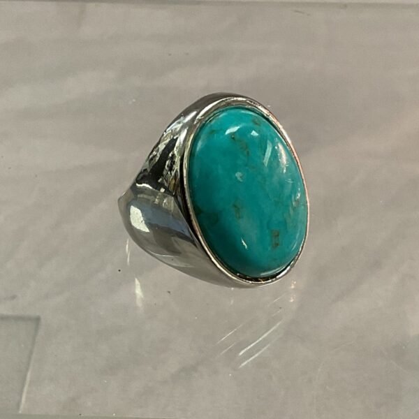 Vintage silver ring with a turquoise cabochon stone.