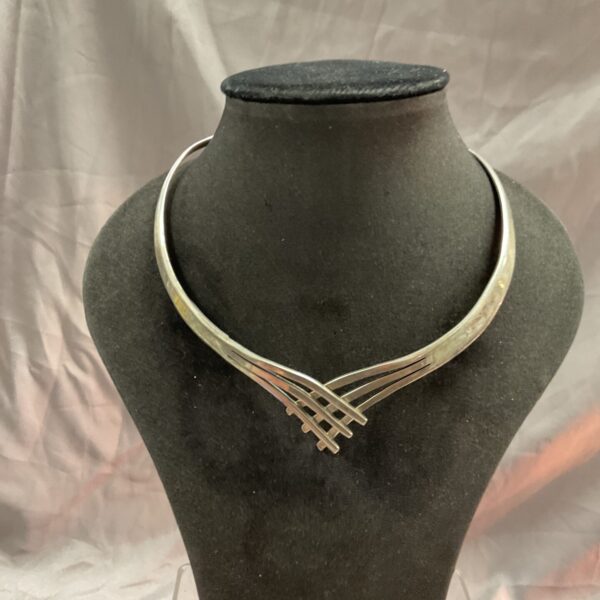 Vintage sterling silver torque necklace with lattice detail.