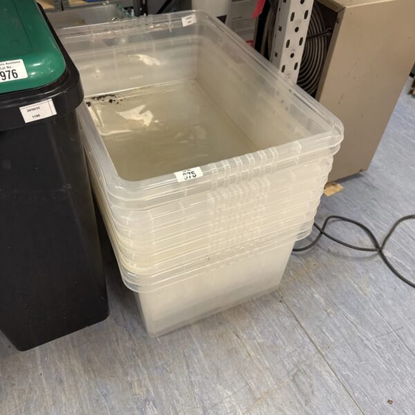 Bundle of clear plastic storage tubs for household organisation.