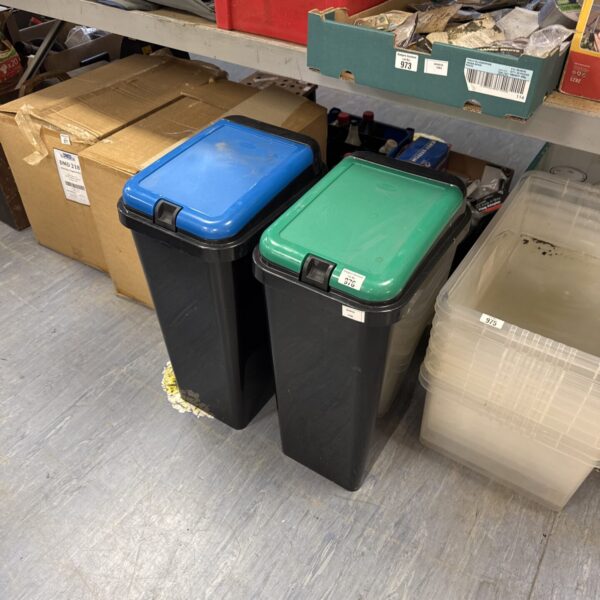 Two used plastic flip top bins for storage and organisation.