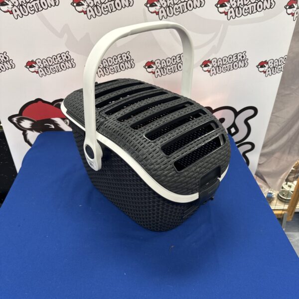 Close-up of a grey Curver cat carry basket with ventilation.