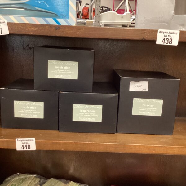 Lot of four Silence & Serenity scented candles in black boxes.