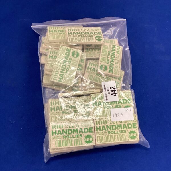 Vintage packet of handmade rolling papers with colourful design.