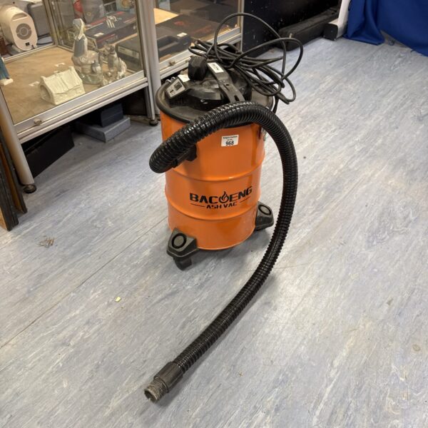 Side view of a Bacoeng ash vacuum with flexible hose.