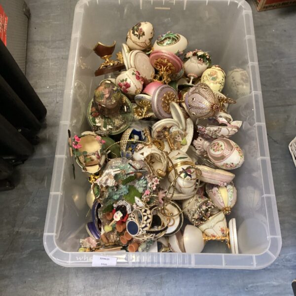 Collection of colourful Russian decorative eggs in a plastic box.
