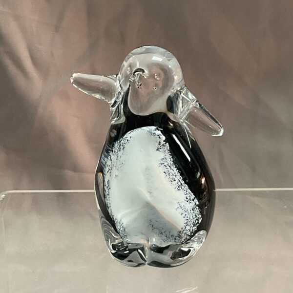 Waterford Crystal penguin paperweight with black and white swirls.