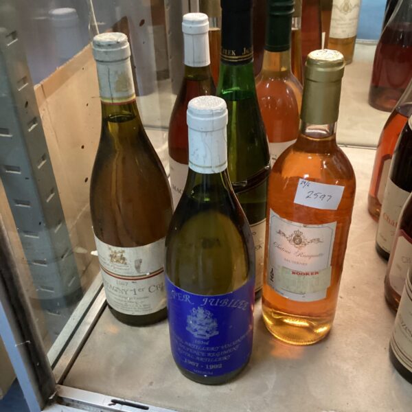 Silver Jubilee wine collection with vintage bottles.