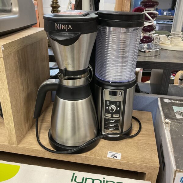 Black Ninja coffee bar brewer on a countertop.