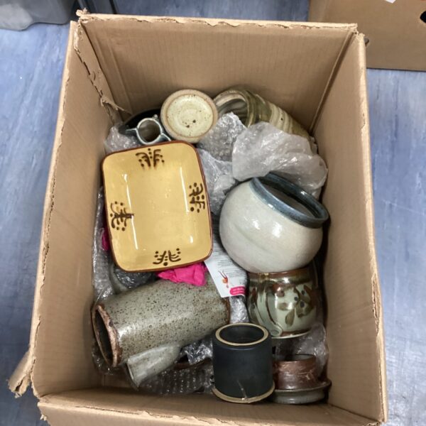 Mixed lot of studio pottery with varied glazes and forms.