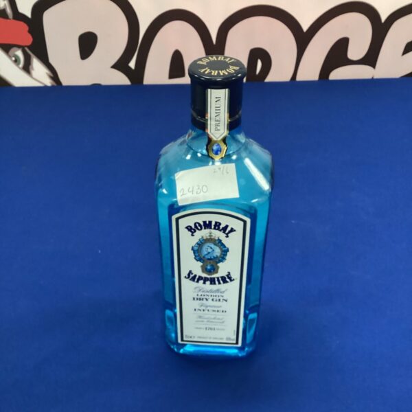 Empty Bombay Sapphire gin bottle with blue glass.