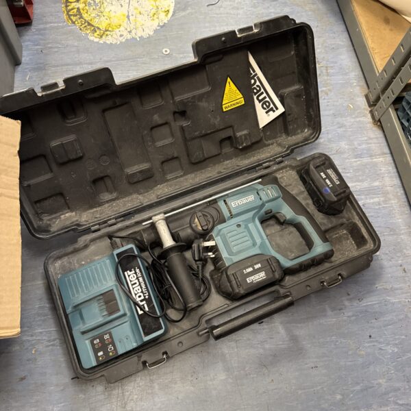 Erbauer cordless SDS drill in open case with charger and battery.
