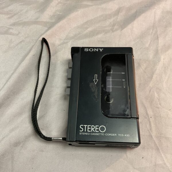 Front view of vintage Sony TCS-430 cassette player with tape compartment open.