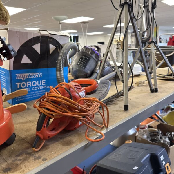 Used Flymo electric hedge trimmer with power cable visible.