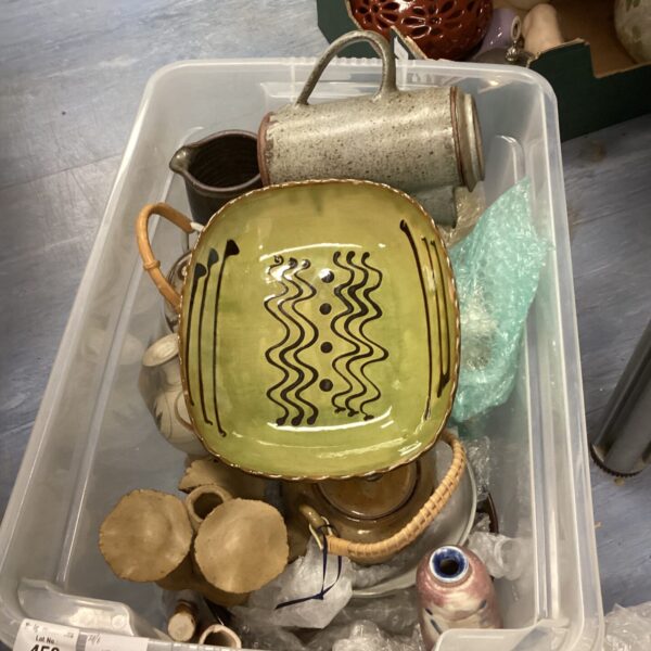 Decorative studio pottery dish with slipware wave pattern.