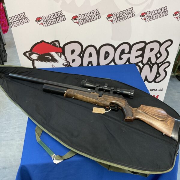 BSA Super Ten air rifle with scope and case, vintage shooting sports.