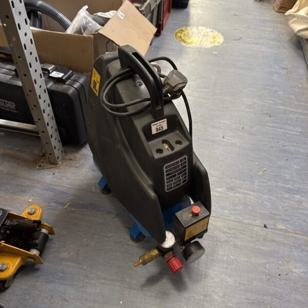 Blue and grey Powerbase portable air compressor in a workshop setting.