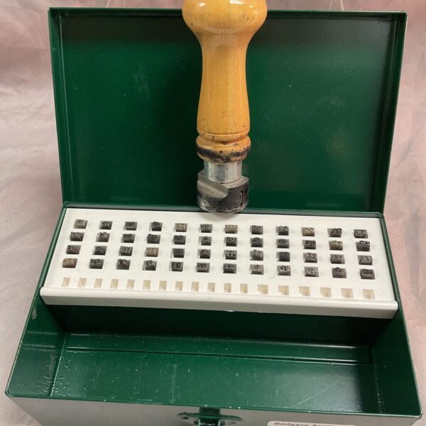 Vintage hand date stamp set in a tin with metal stamps.