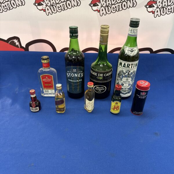 Selection of vintage alcohol bottles including Martini.