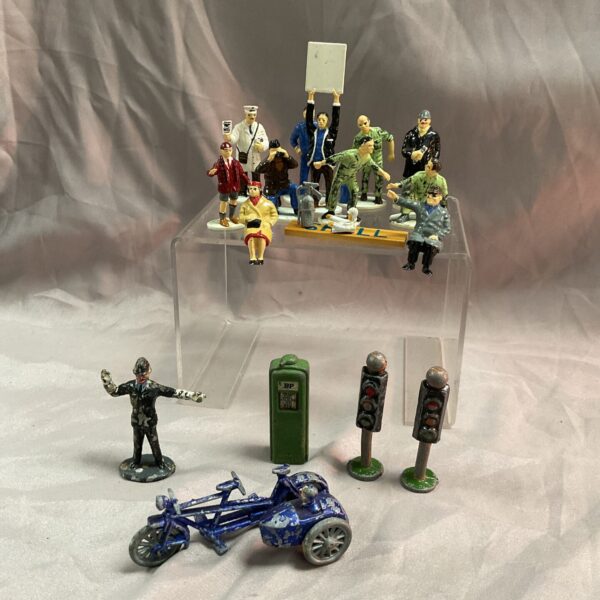 Vintage Scalextric and metal figures lot for collectors and racing enthusiasts.