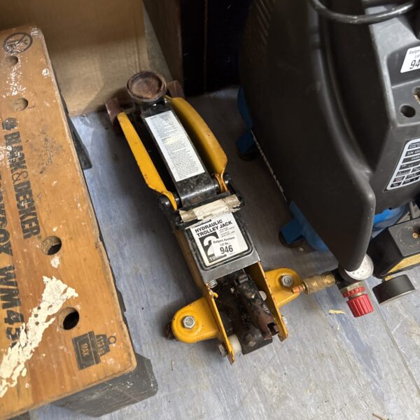 Used Halfords 2 ton trolley jack in a workshop setting.