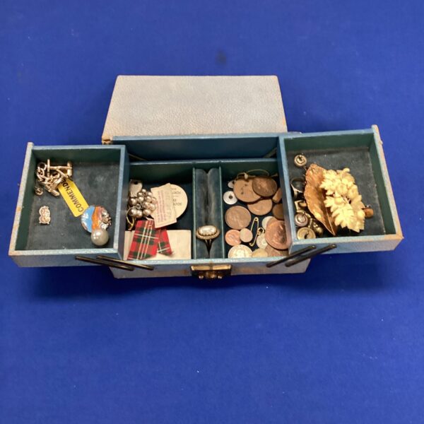 Vintage jewellery box filled with assorted jewellery and coins.
