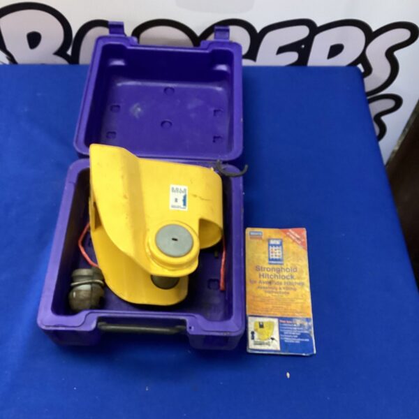 Yellow Stronghold trailer hitchlock for trailer security.