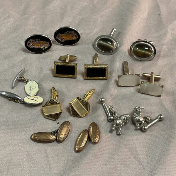 Vintage cufflinks lot featuring various styles and finishes.