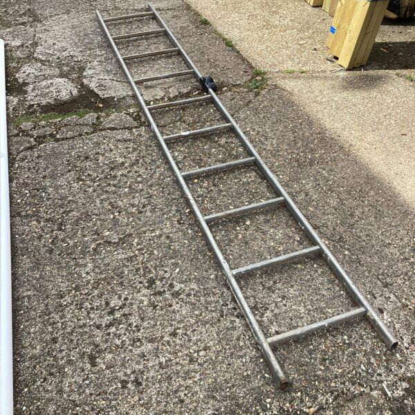 Close-up of an aluminium ladder with multiple rungs.