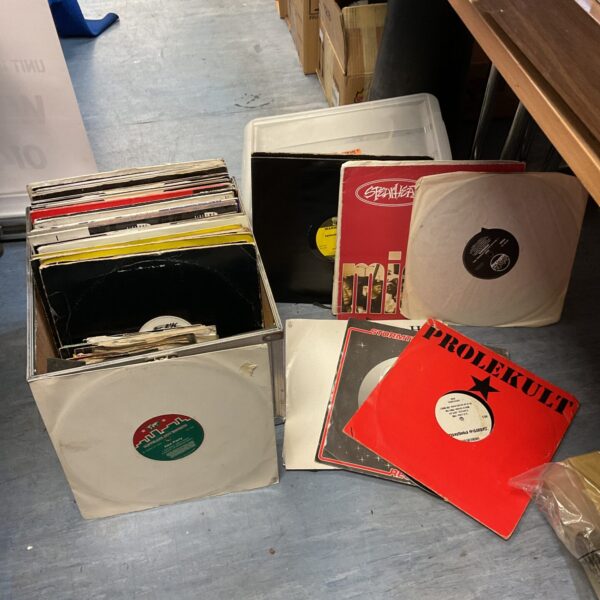 Aluminium case filled with 12 inch dance music vinyl records.