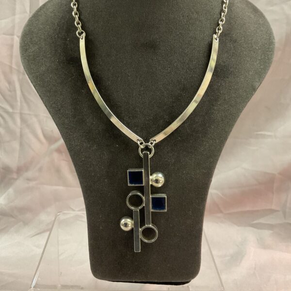 Silver tone 1960s modernist necklace with geometric shapes.
