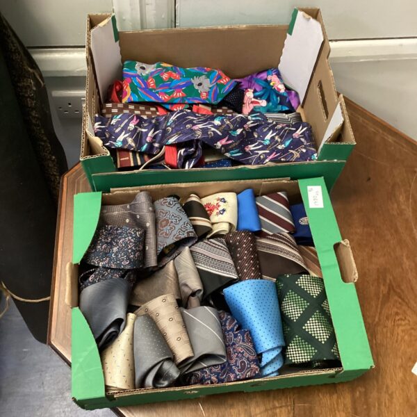 Assorted ties in a cardboard box, vintage men's fashion.