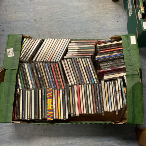 Tray of assorted music CDs, a large collection for music lovers.