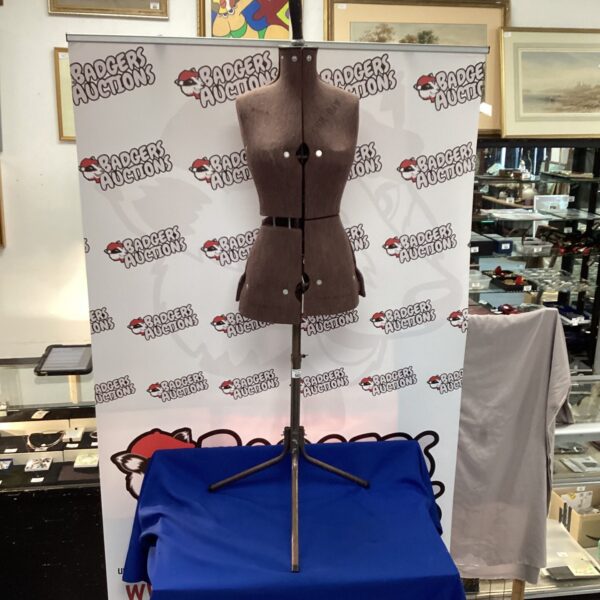 Vintage dressmaker manikin, a classic tailoring tool.