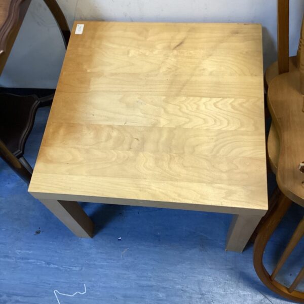 Vintage wood coffee table in mid-century modern style.