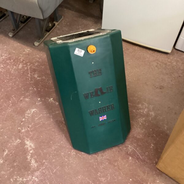 Side view of a vintage green wellie washer with Union Jack.