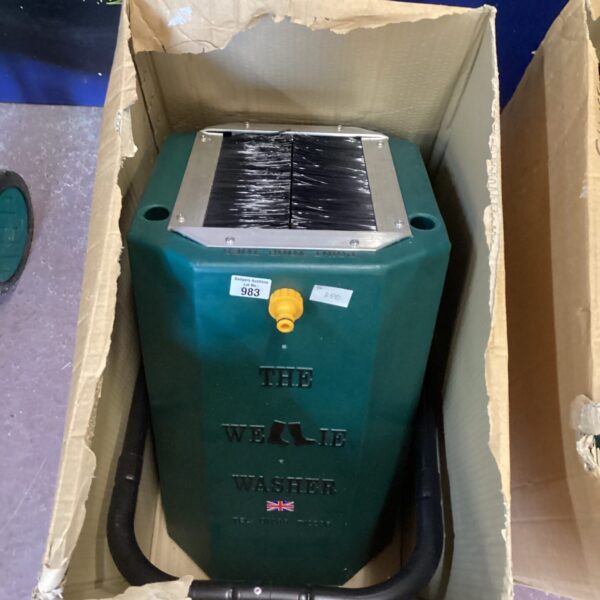 Green Wellie Washer device for cleaning muddy boots.