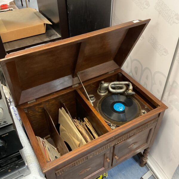 Vintage Gilbert gramophone cabinet with wooden finish.