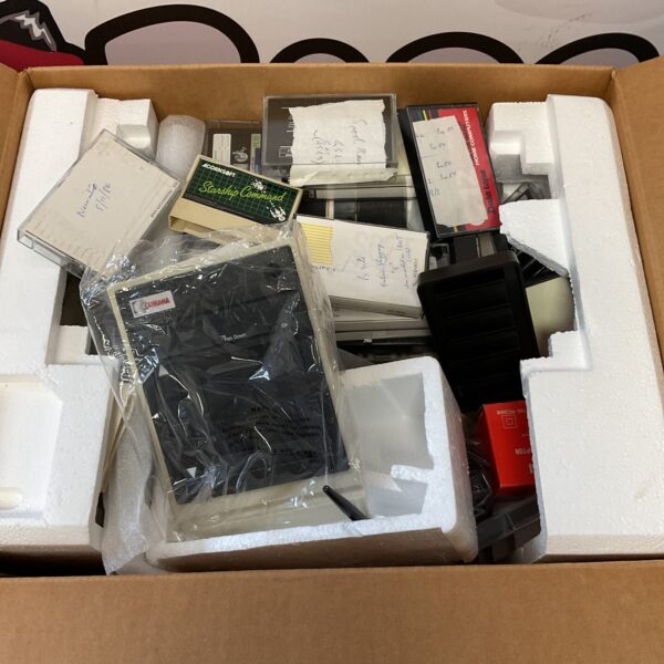 Mixed lot of Acorn computer cassettes and cartridges for retro gaming.
