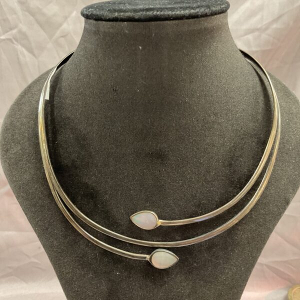 Elegant sterling silver choker necklace with mother of pearl pendant.