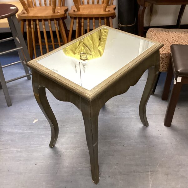Vintage hall table with a mirrored top in a shabby chic style.