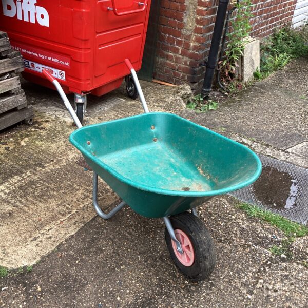 Used plastic wheelbarrow for garden and yard work.