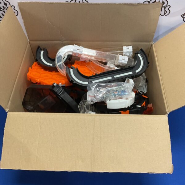 Hexbug sets and robotic insects in a cardboard box.