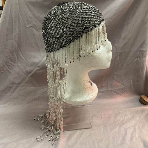 Vintage 1930s flapper headpiece with delicate beaded fringe.
