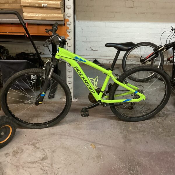 Green Rockrider mountain bike for off-road cycling adventures.