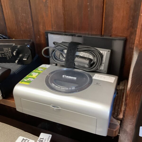 Canon CP-200 compact photo printer with power adapter.