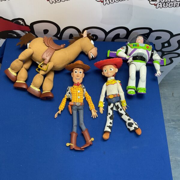 A lot of Disney Pixar Toy Story figures, including Woody.