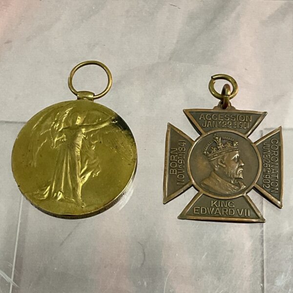 Gold Edward VII medal, British commemorative collectible.