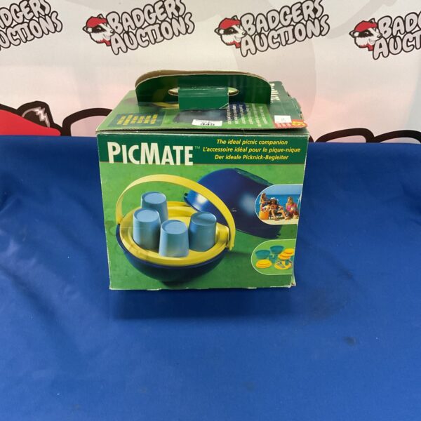 Vintage Picmate picnic set with colourful plates and cups.
