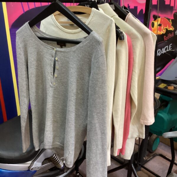 Ladies’ cable knit wool jumper in neutral colour.